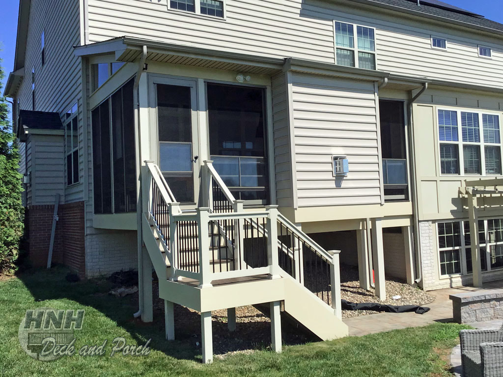 3 season room with gas fireplace with Timbertech Reserve decking
