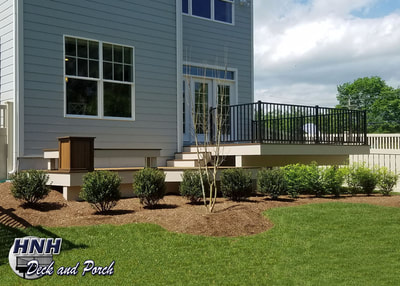 Trex Transcend composite deck using Havana Gold and Spiced Rum with Westbury black aluminum railing and balusters.