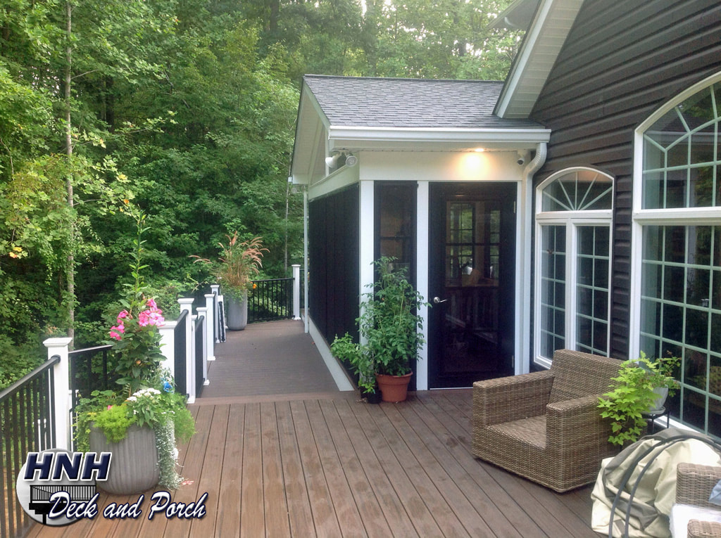 Trex Transcend composite deck using Spiced Rum flooring and Westbury aluminum railing. Weather Master porch.