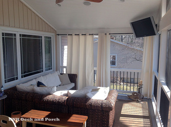 Low maintenance screened porch with curtains for privacy.