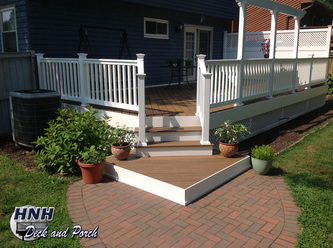 Low maintenance Trex Transcends deck with steps and landing.