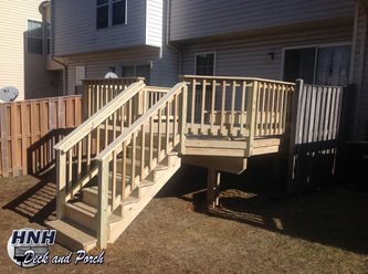 Steps using ACQ pressure treated pine wood deck with.
