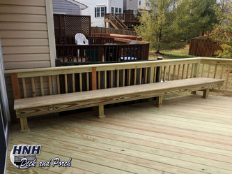 ACQ pressure treated pine wood deck with bench.