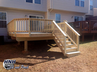 ACQ pressure treated pine wood deck with bench.
