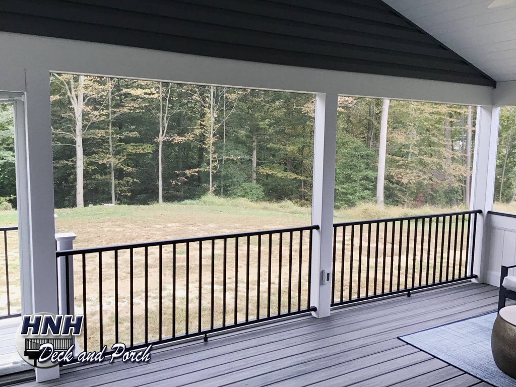 Screened porch with black Westbury aluminum railing.